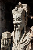 Bangkok Wat Arun - Details of the statues of Chinese saints of the pagoda at the corners of the Ubosot coutyard. 